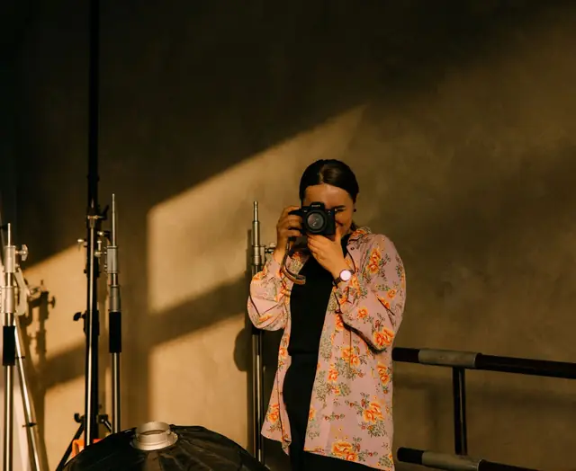 A photographer shooting in a studio