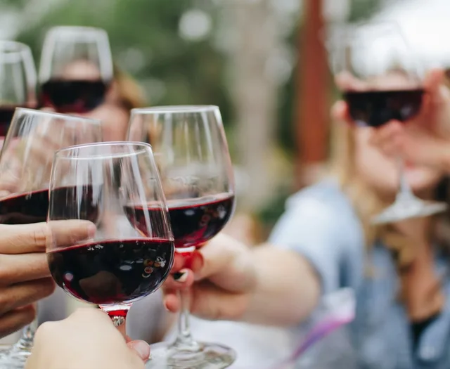 Wine glasses and bottles on a tasting bar